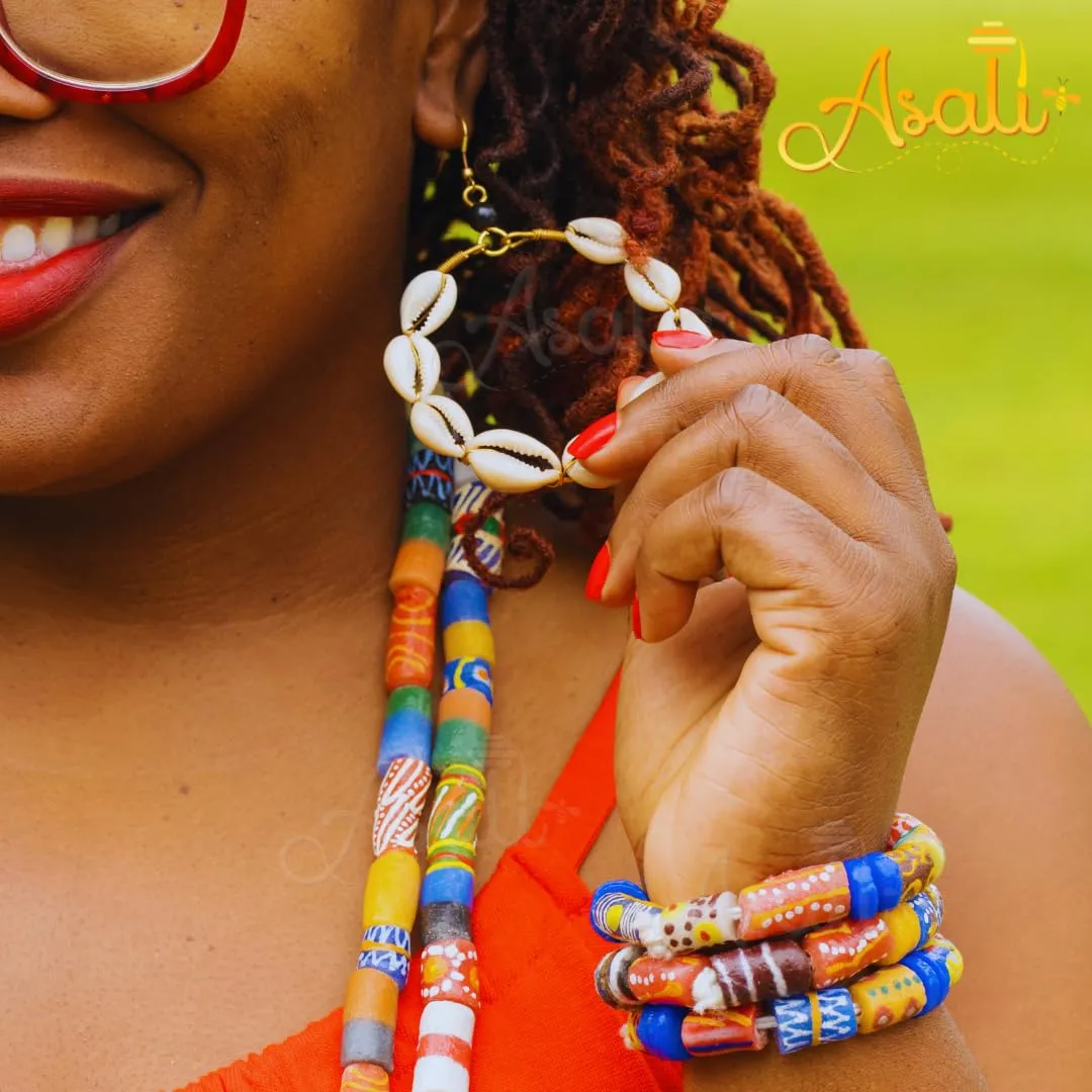 Shop Asali's Kenyan Brass Earrings: Multiple Cowrie Shell Designs and Africa Map (Multiple Cowire Shells)